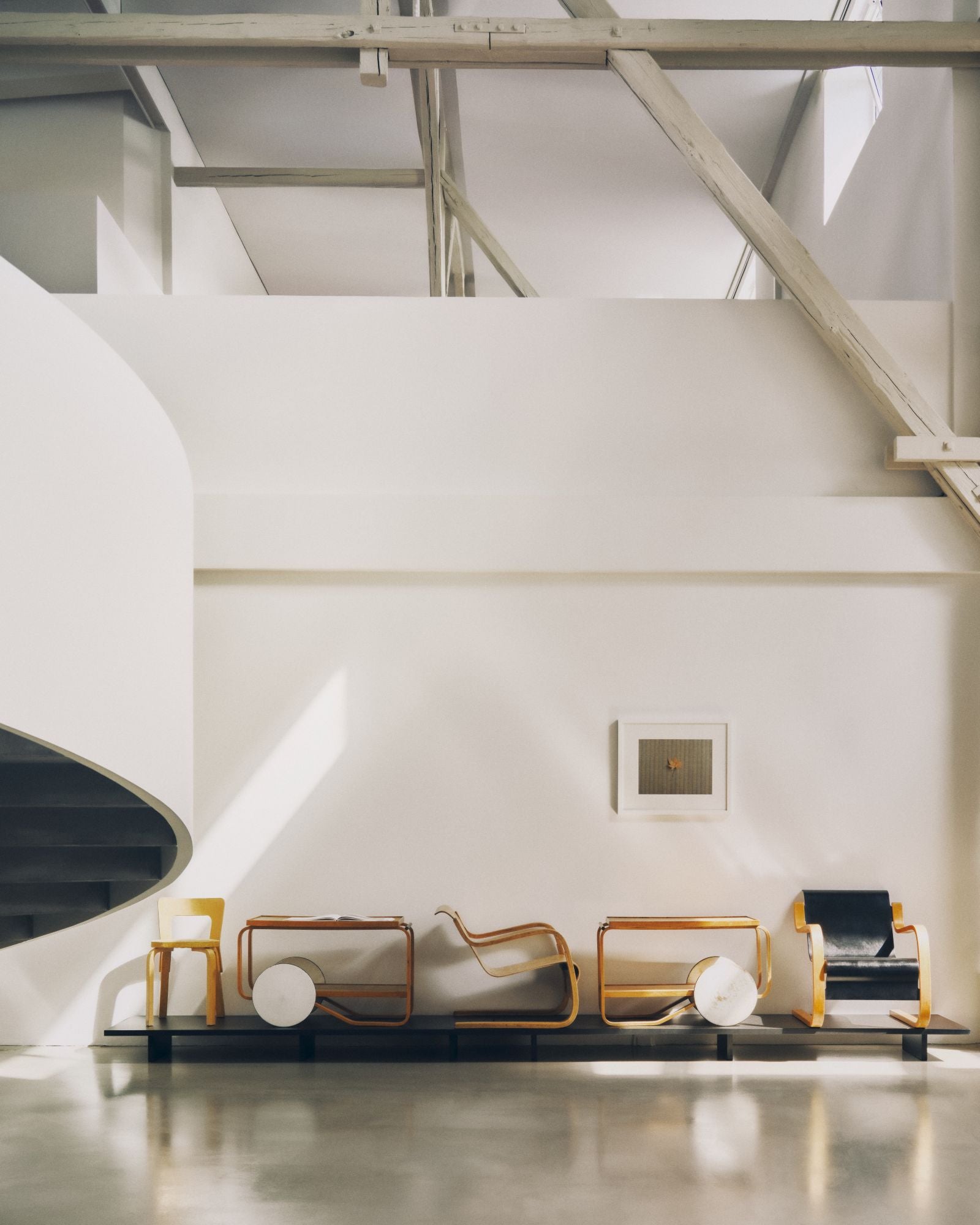 Modern interior with minimalist furniture and a white wall.