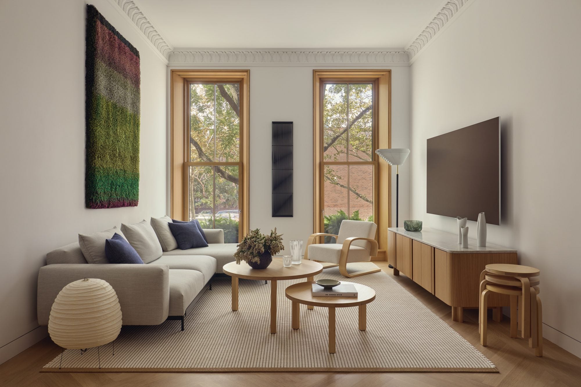 Modern living room with a sofa, coffee table, and television.