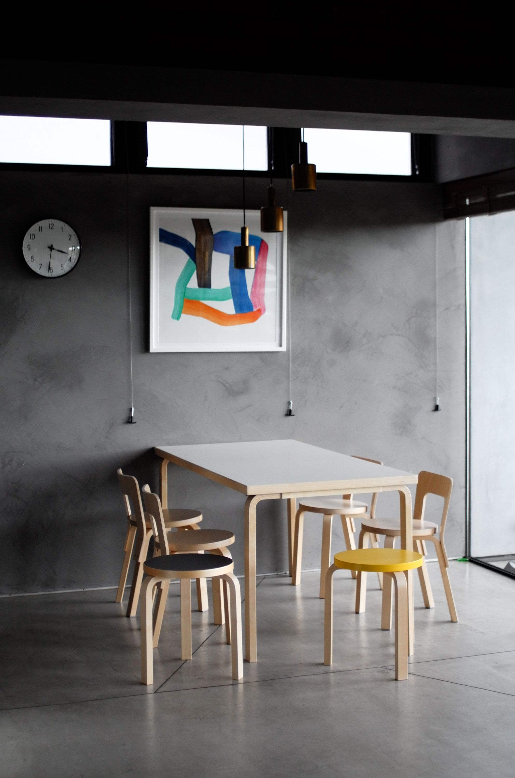Modern interior with abstract art on a gray wall