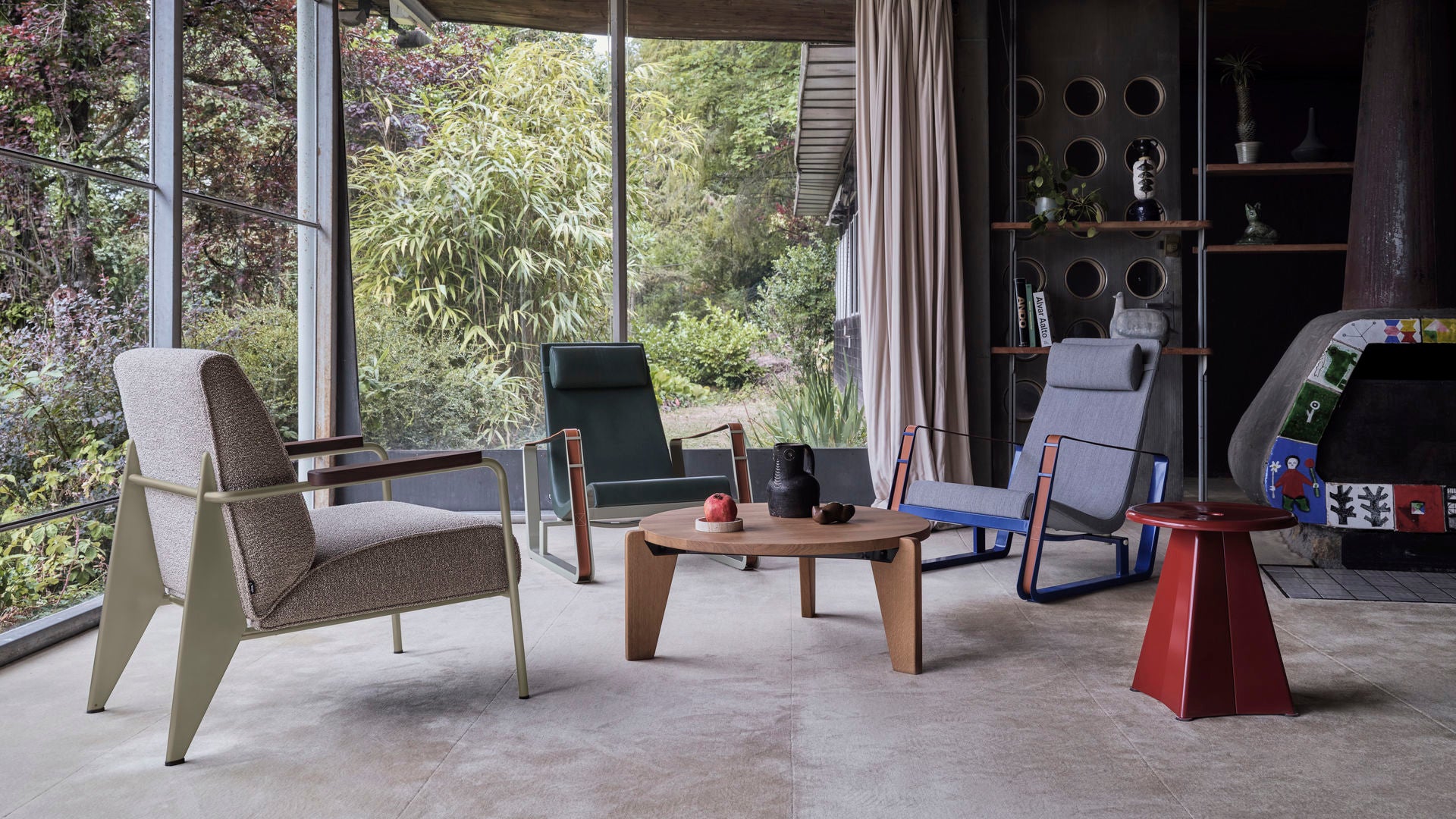 Modern outdoor furniture set with chairs and a table in a garden setting