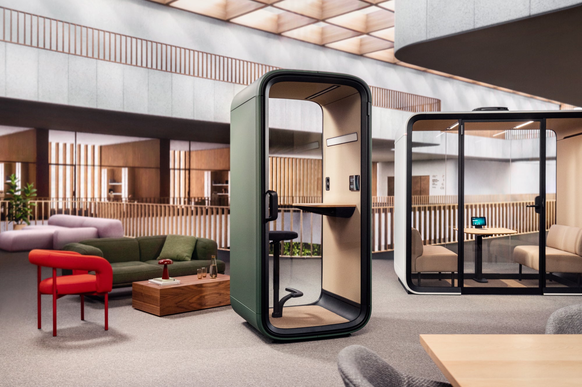 Modern office space with a glass partitioned office pod.