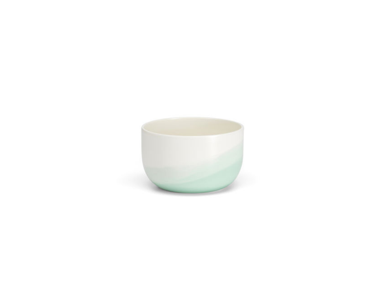 Small ceramic cup with a gradient from green to white on a white background