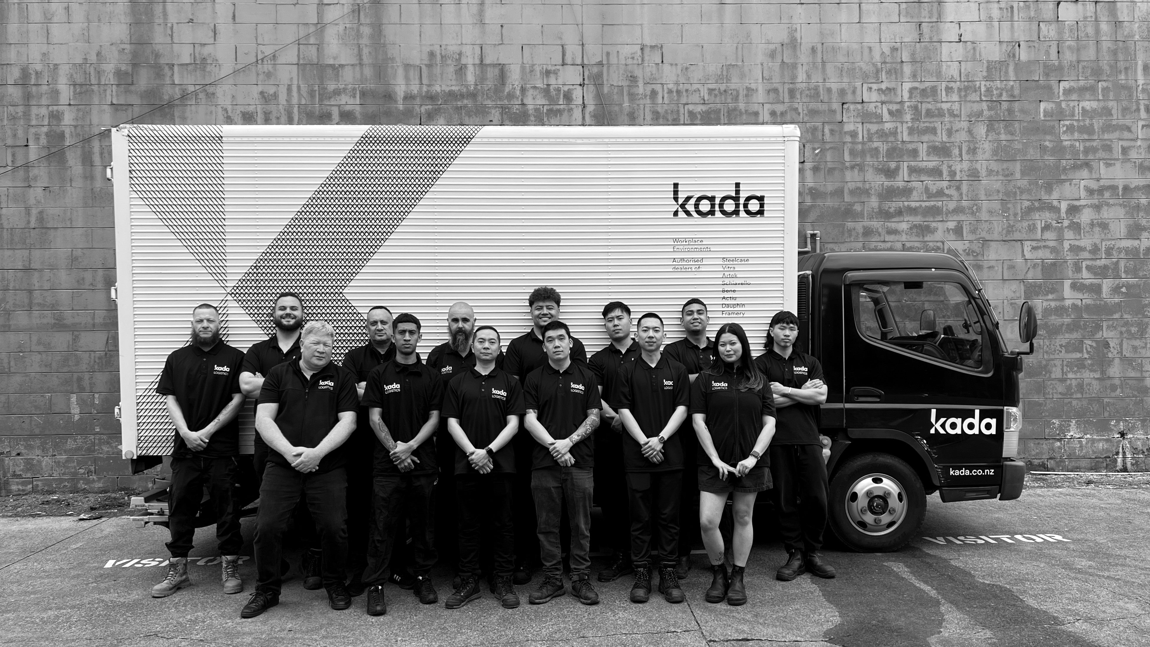 Group of people posing in front of a Kada truck