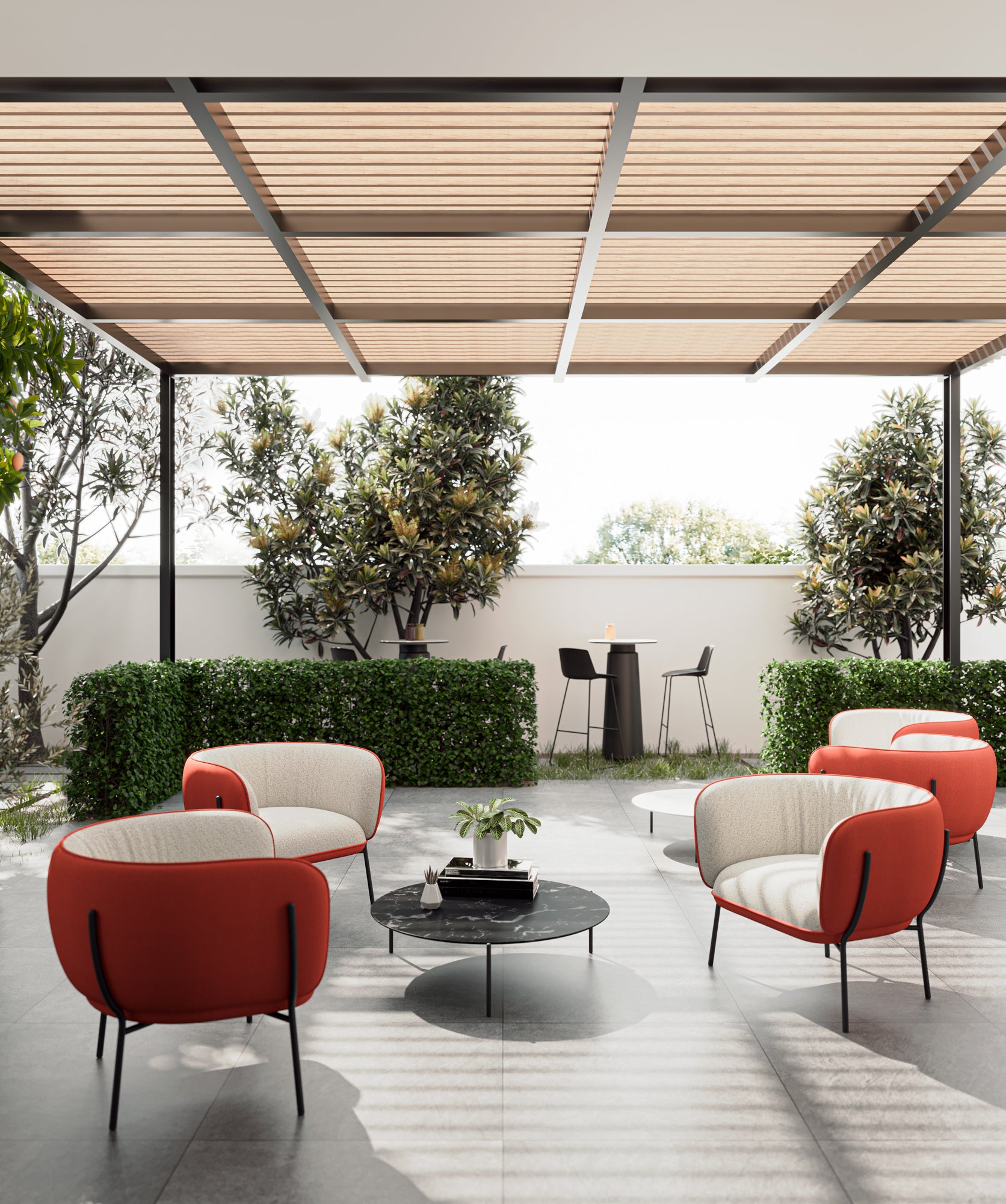 Modern outdoor patio with red and white chairs, a coffee table, and a canopy.