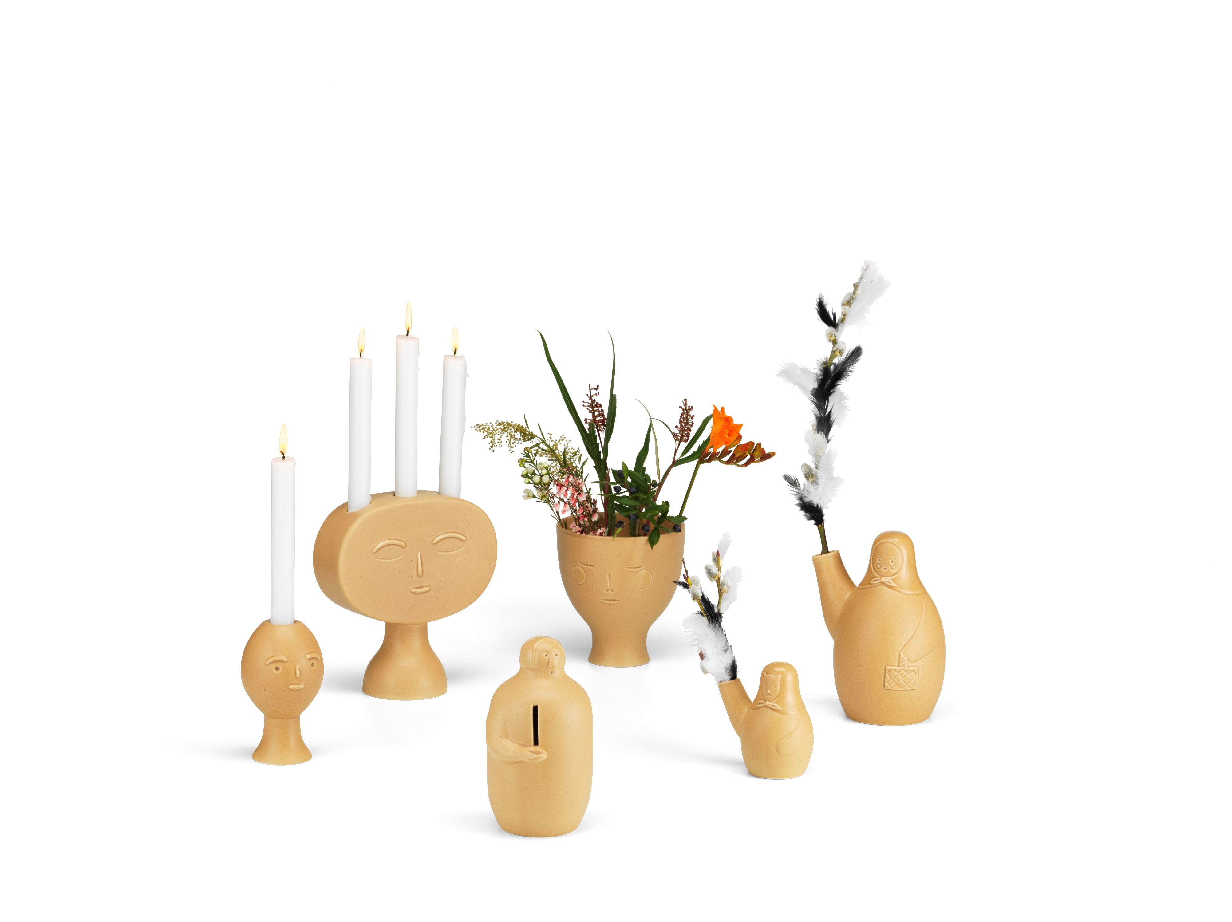 Set of decorative vases and candle holders on a white background